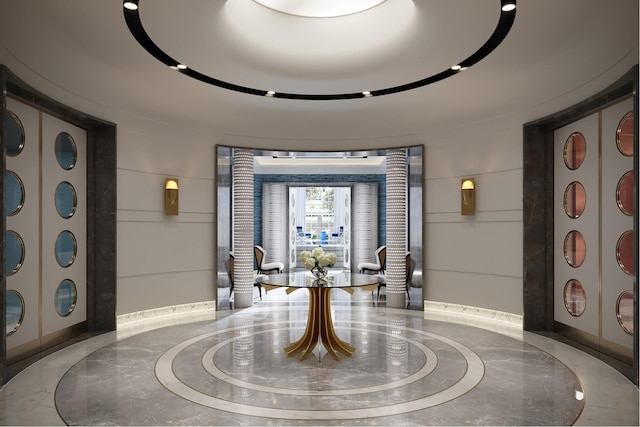 foyer entrance with marble finish floor and ornate columns