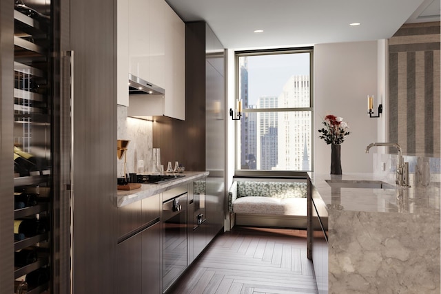 interior space with recessed lighting and a sink