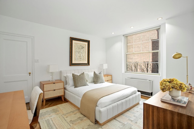 bedroom with radiator and recessed lighting