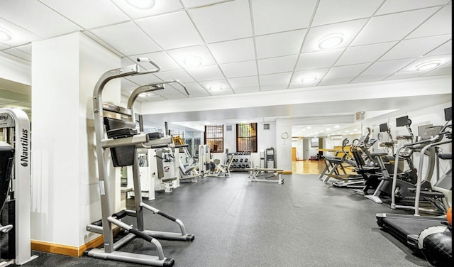 gym featuring a paneled ceiling