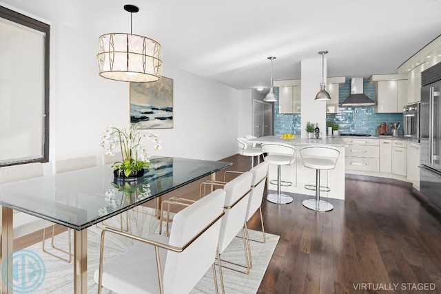 dining space with dark hardwood / wood-style floors