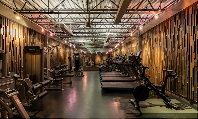 exercise room featuring wooden walls