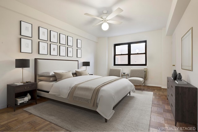 bedroom featuring baseboards and ceiling fan