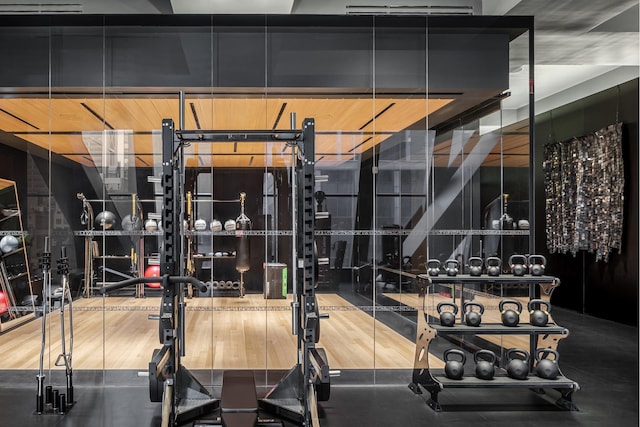 workout area with wood finished floors