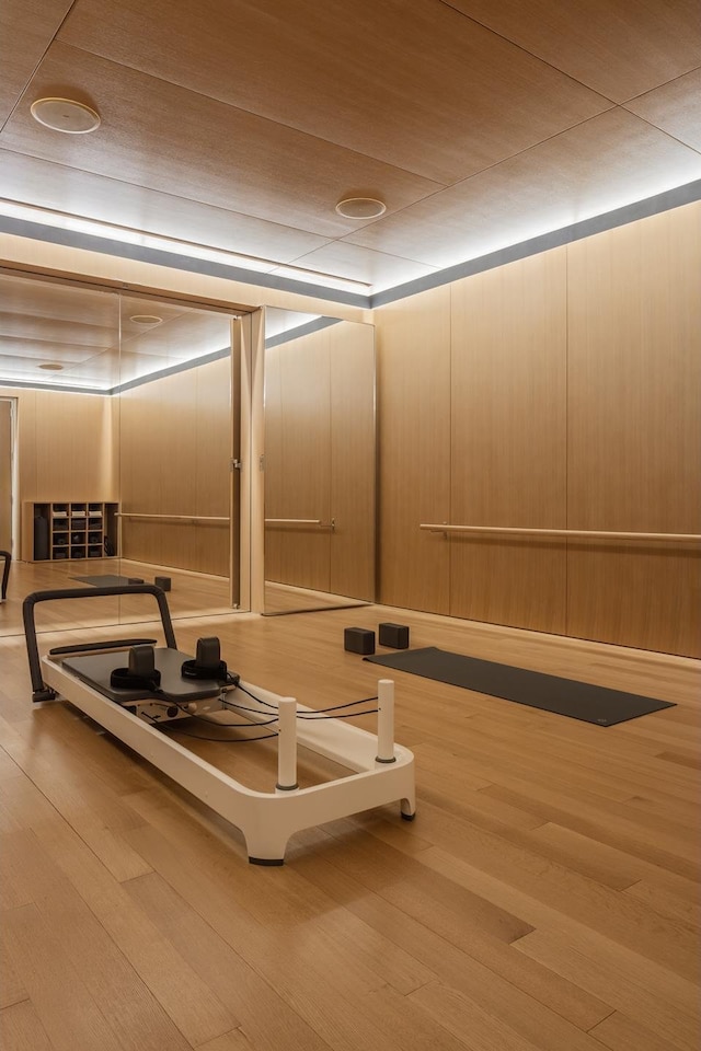 workout area featuring wood finished floors