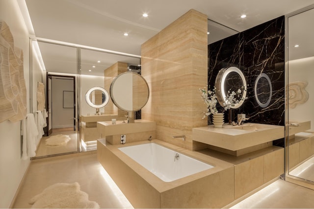 full bathroom featuring a garden tub, a shower stall, concrete flooring, and recessed lighting