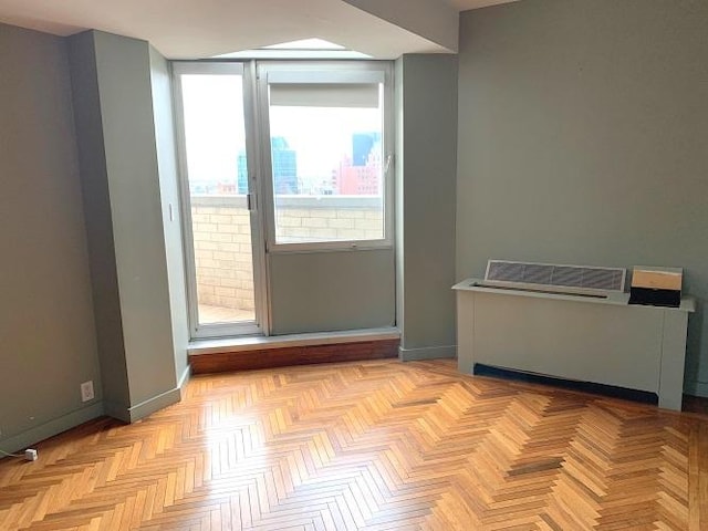 spare room featuring baseboards