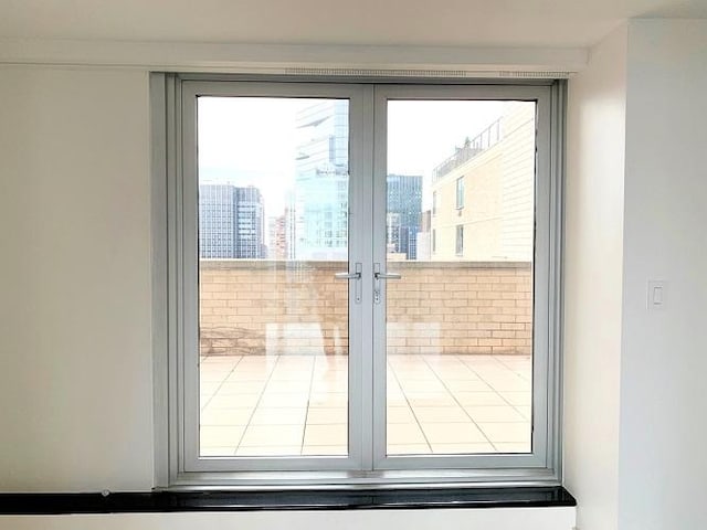 doorway to outside with french doors and a city view