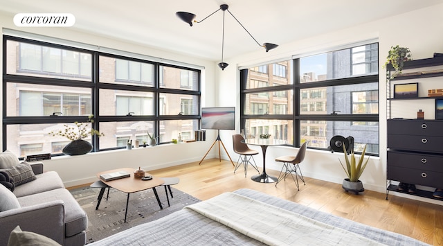 interior space with visible vents, baseboards, and wood finished floors