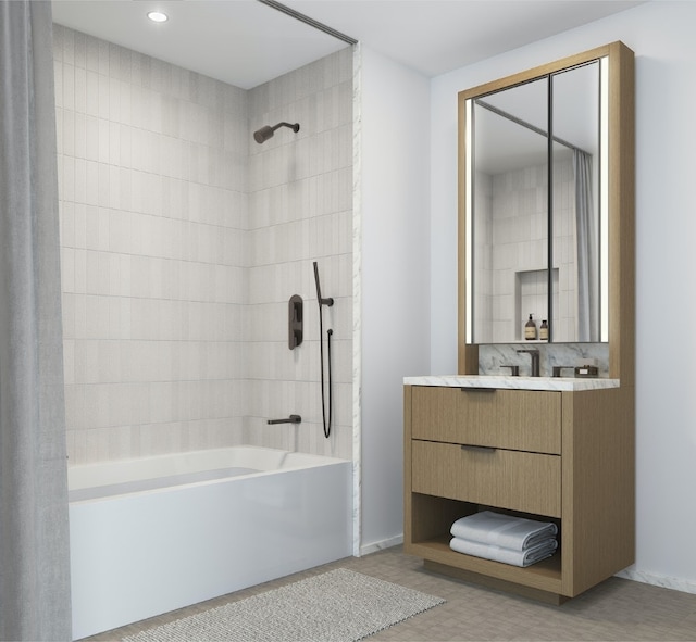 bathroom with tiled shower / bath, vanity, and wood-type flooring