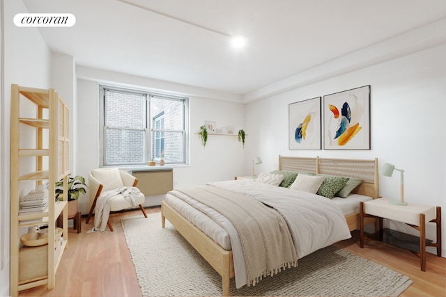 bedroom with wood-type flooring