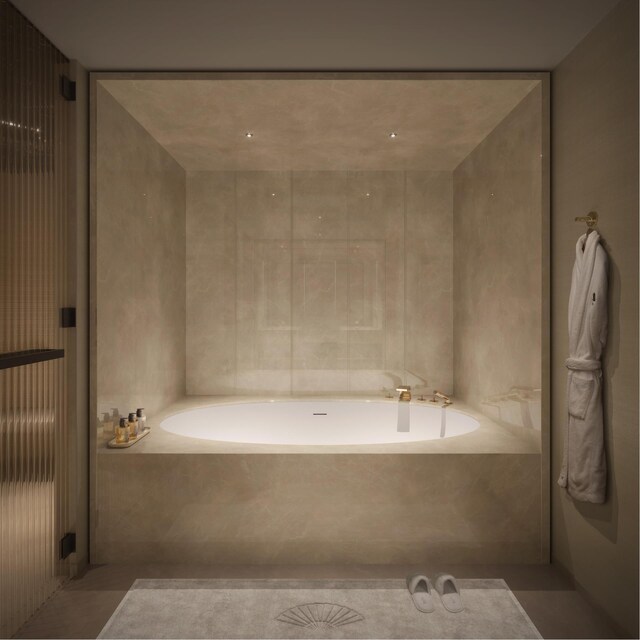 bathroom featuring tiled tub