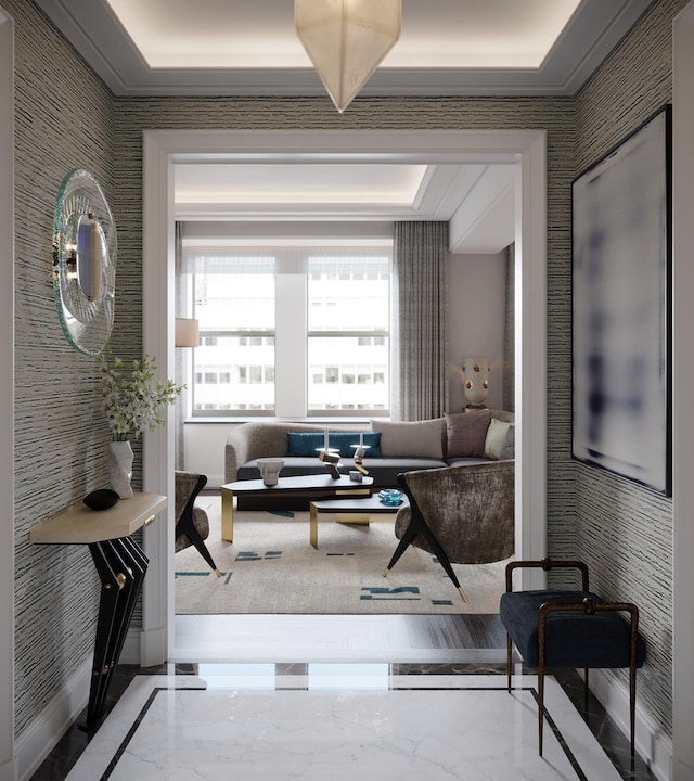 living area featuring marble finish floor and crown molding