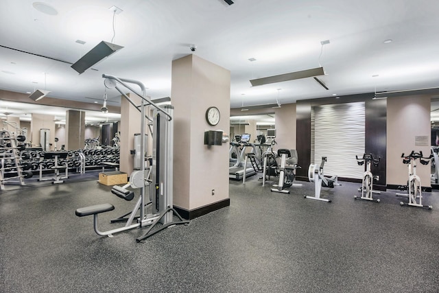 workout area featuring baseboards