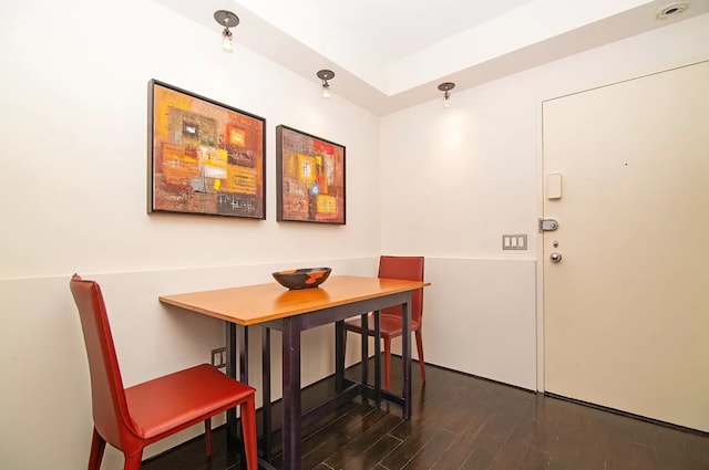 dining room with dark hardwood / wood-style floors