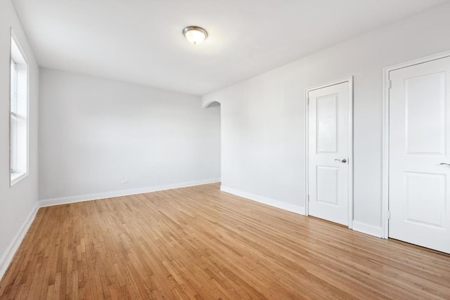 unfurnished room featuring light hardwood / wood-style floors