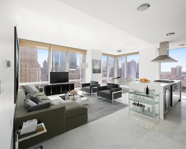 247 W 46th St Unit 1803, New York City, NY 10036 - living area with plenty of natural light and light marble finish flooring