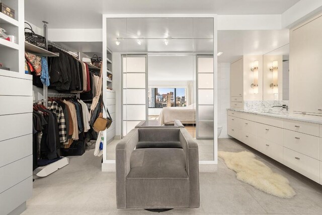 interior space with track lighting and light hardwood / wood-style floors