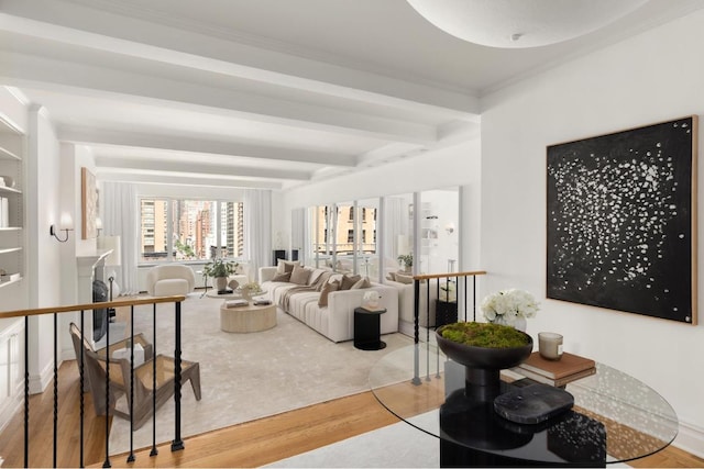 living room featuring beam ceiling and wood-type flooring