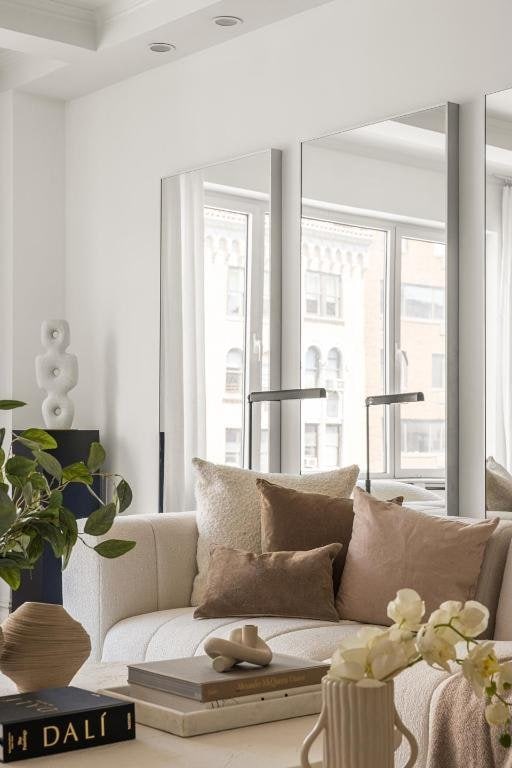 living room with ornamental molding