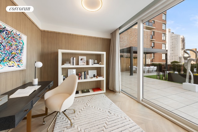 office area featuring wooden walls and parquet flooring