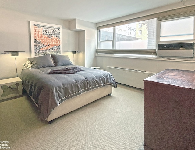 carpeted bedroom featuring radiator