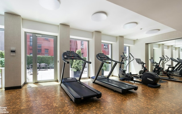 exercise room with tile patterned floors