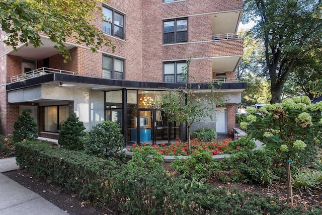 exterior space with brick siding