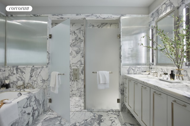 full bathroom featuring marble finish floor, vanity, a marble finish shower, and a bath