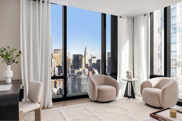 sitting room with a city view and floor to ceiling windows