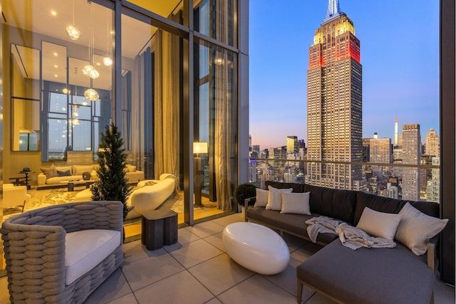 277 5th Ave Unit Ph53, New York City, NY 10016 - patio terrace at dusk with an outdoor hangout area and a view of skyline