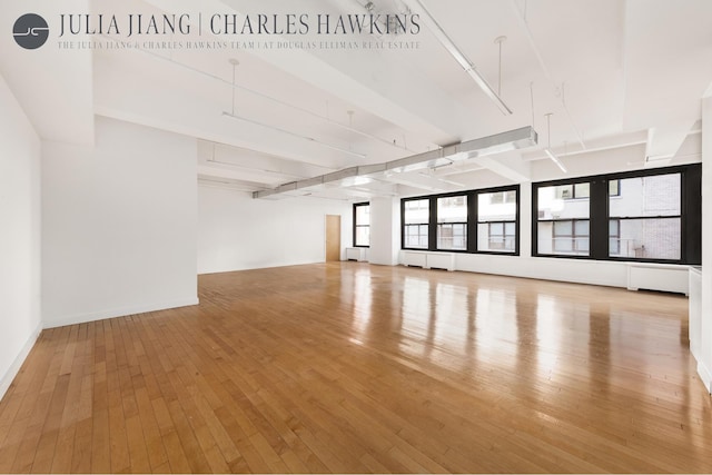 315 W 36th St Unit 12B, New York City, NY 10018 - unfurnished room with hardwood / wood-style flooring and baseboards