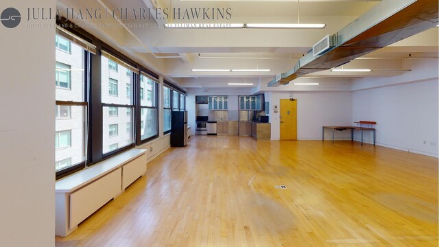 unfurnished living room featuring light hardwood / wood-style flooring