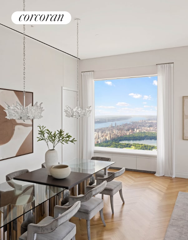 dining area featuring parquet flooring and a healthy amount of sunlight