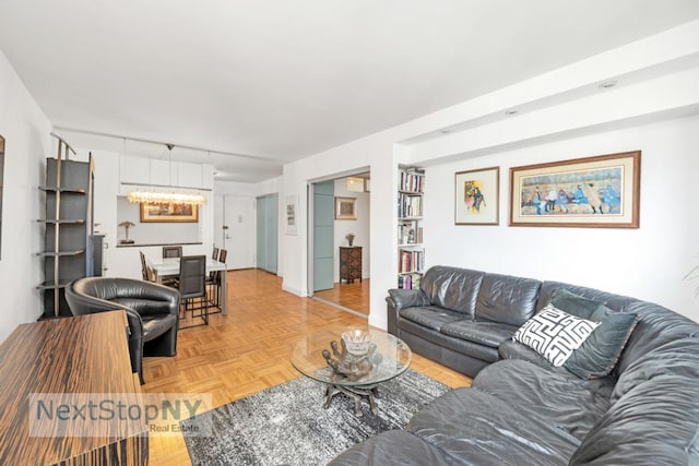 living room with light parquet flooring and track lighting