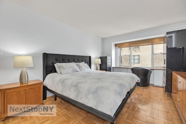 bedroom featuring light parquet flooring