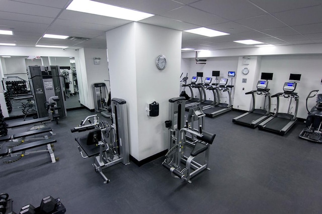 exercise room with a paneled ceiling