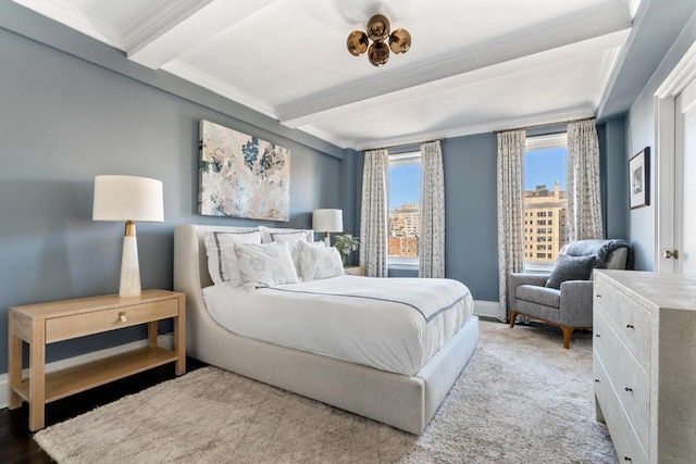 bedroom featuring crown molding and beamed ceiling