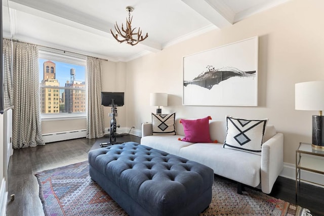 sitting room featuring a baseboard heating unit, dark wood-type flooring, a notable chandelier, ornamental molding, and beamed ceiling