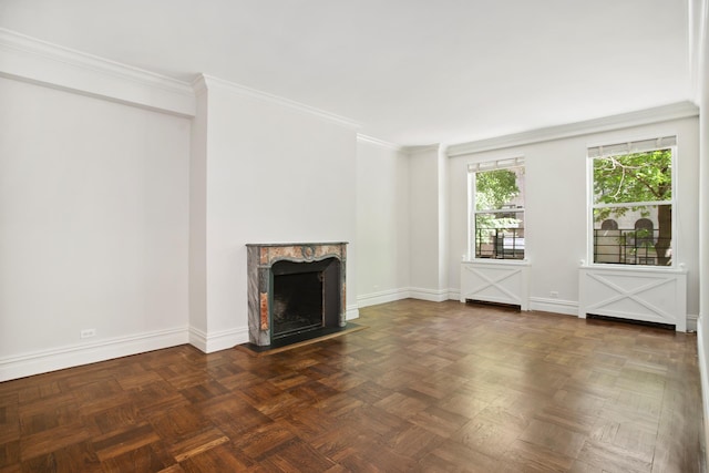 unfurnished living room with baseboards, ornamental molding, and a high end fireplace