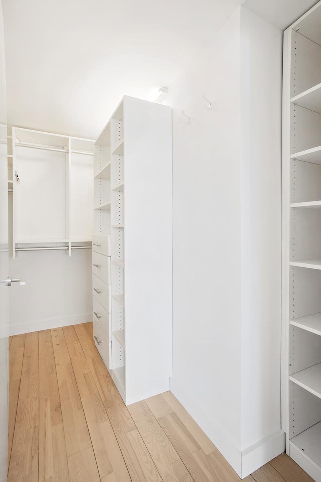 322 W 57th St Unit 55S1, New York City, NY 10019 - walk in closet featuring light wood-style flooring