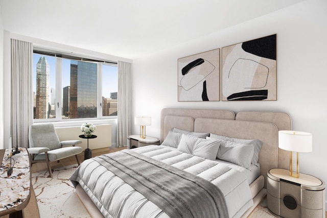 322 W 57th St Unit 55S1, New York City, NY 10019 - bedroom with wood finished floors and a city view