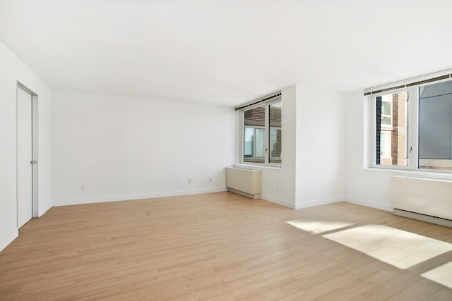 322 W 57th St Unit 55S1, New York City, NY 10019 - unfurnished room with healthy amount of natural light and light wood-type flooring