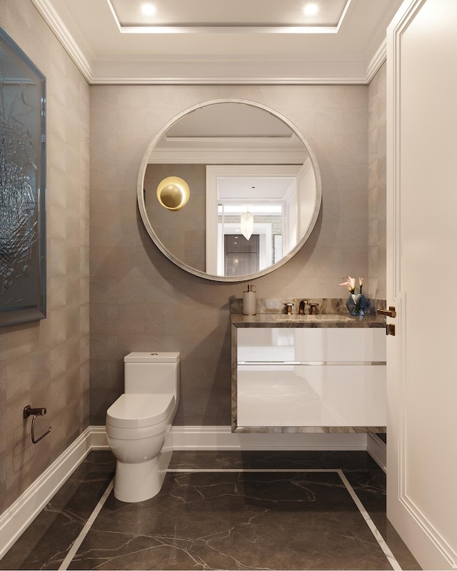 half bath featuring vanity, baseboards, crown molding, toilet, and marble finish floor