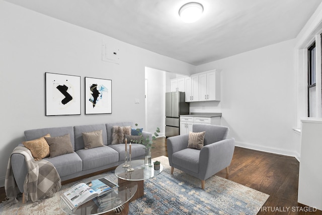 living room with dark wood-style flooring and baseboards