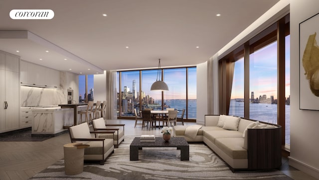 living area with a view of city, expansive windows, visible vents, and recessed lighting