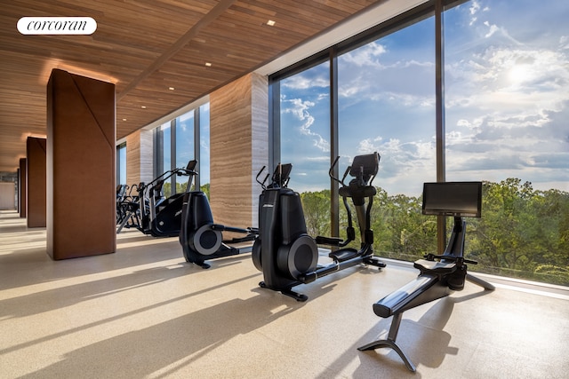 workout area with wooden ceiling, visible vents, and expansive windows