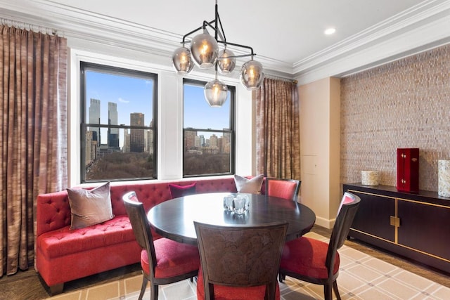 dining space featuring crown molding