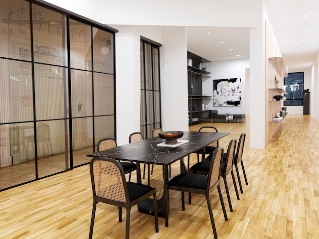 dining room featuring recessed lighting and light wood-style floors