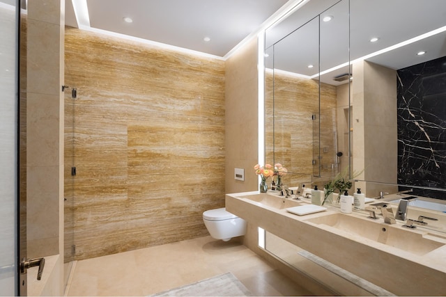 53 W 53rd St Unit 16F, New York City, NY 10019 - bathroom with tile walls, an enclosed shower, tile patterned flooring, double vanity, and recessed lighting